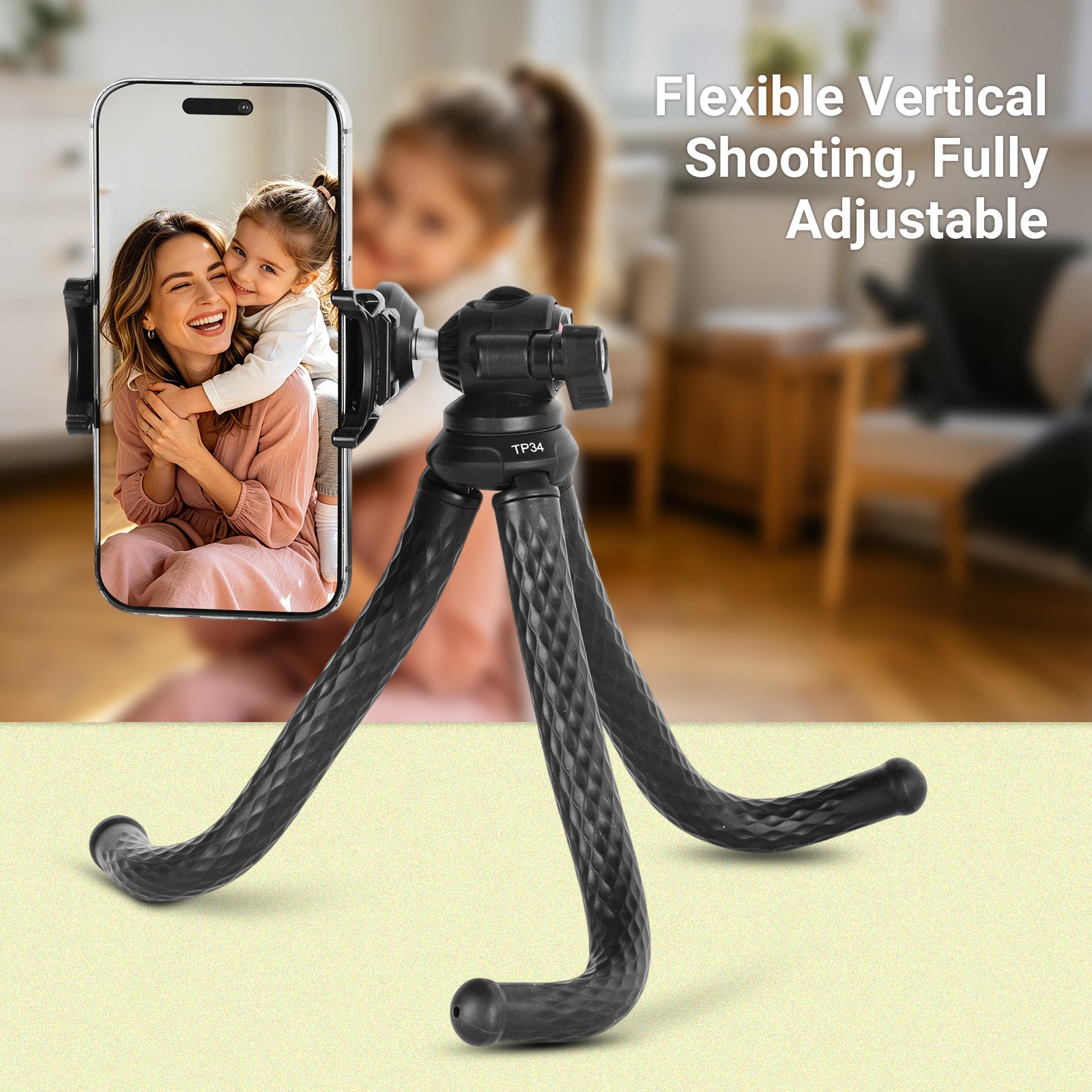 Flexible phone tripod with smartphone displaying a mother and child, set against a blurred indoor background.