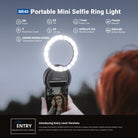 A girl is using the NEEWER BR40 Mini Phone Selfie Ring Light to illuminate her selfie.