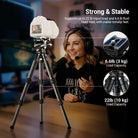 Female live streamer doing indoor vlog shooting with carbon fiber camera tripod holding DSLR camera which supports up to 22 lbs payload